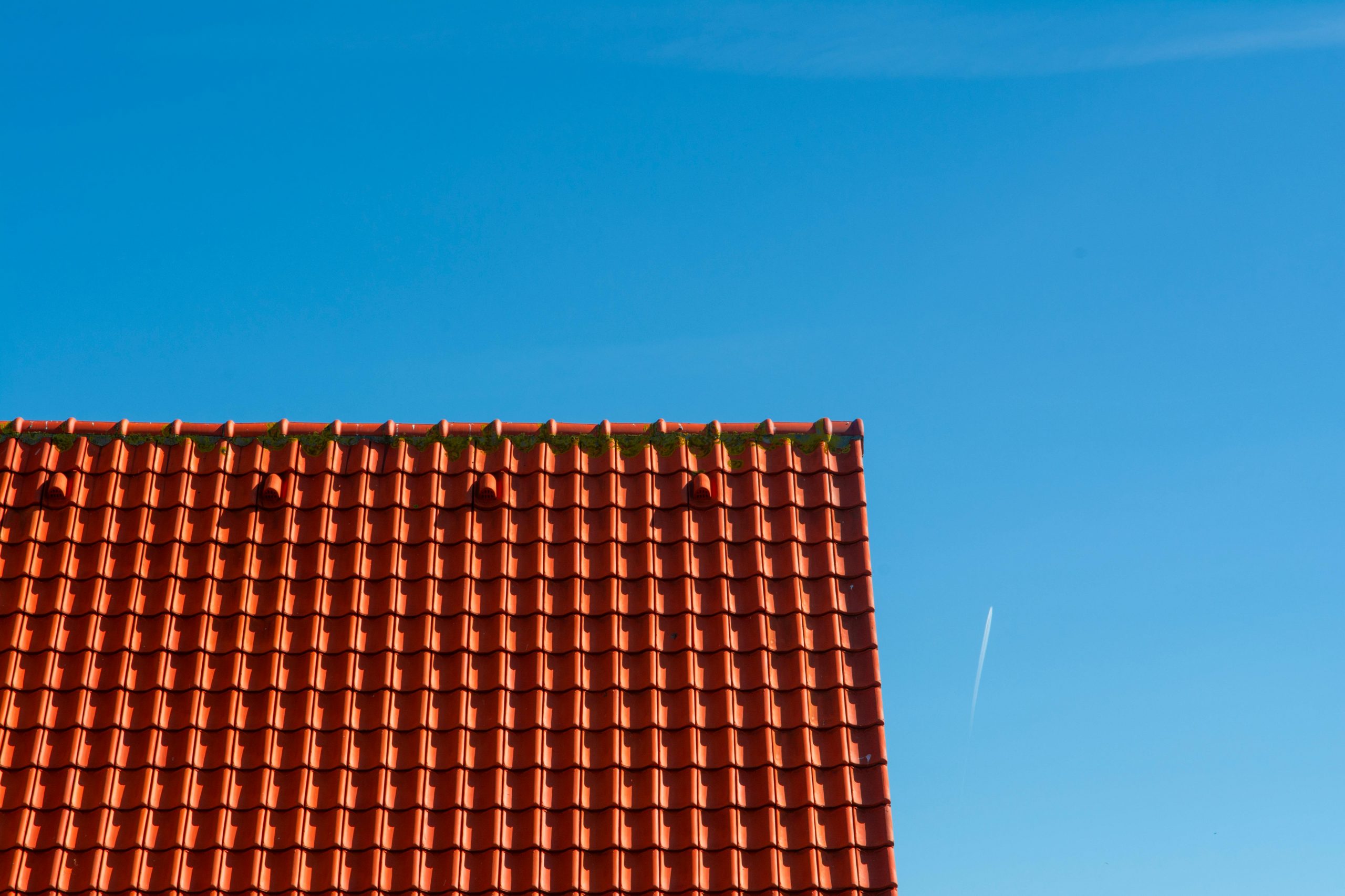 orange metal roof under clear skies